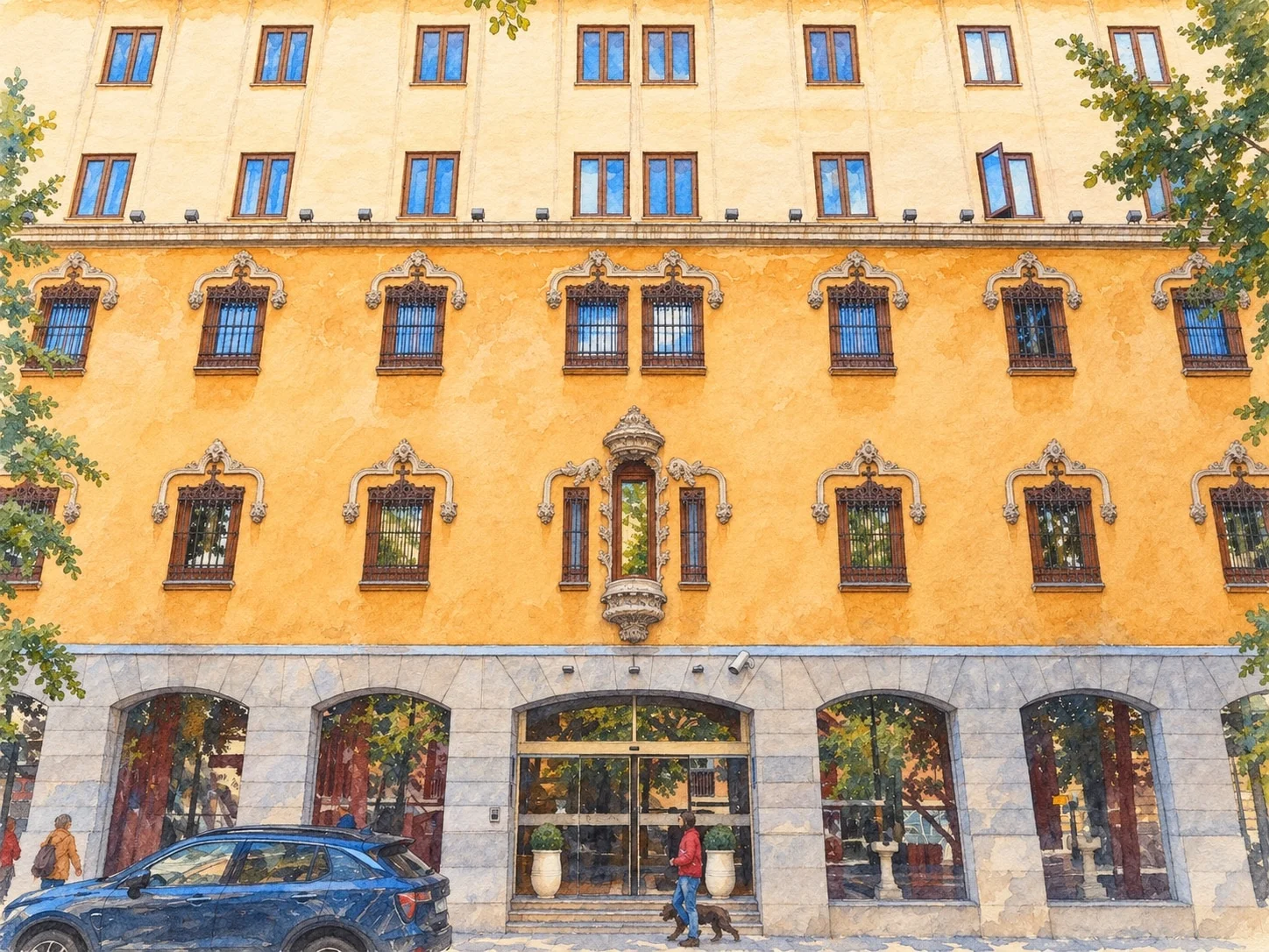 Photograph de la façade de l'Hôtel Palacio de Santa Paula, avec ses fenêtres ornées et sa porte centrale sur la Gran Vía de Colón